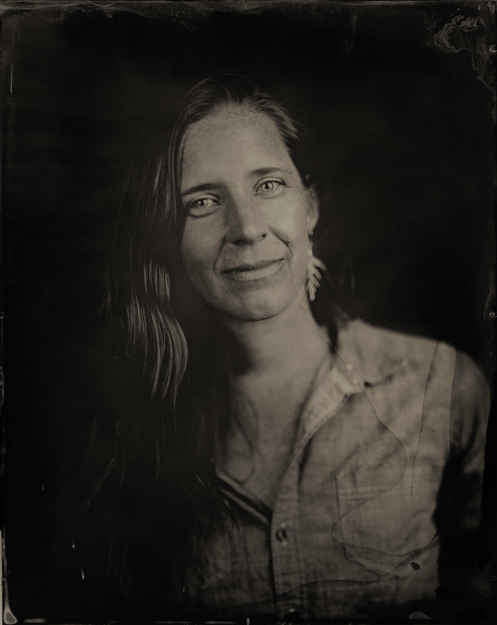 Corrie Williamson author photo. Smiling, black and white photo