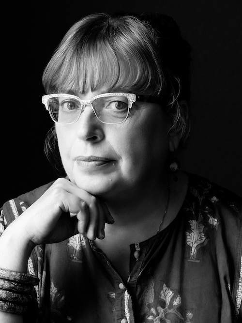 Black and white headshot of Daisy Rockwell